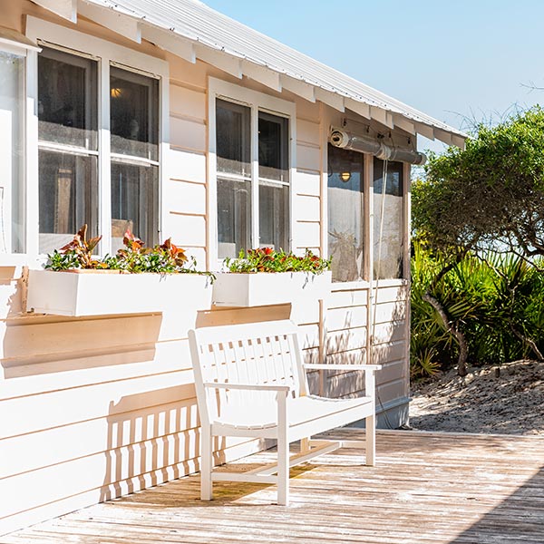 Wooden bench and cottage house